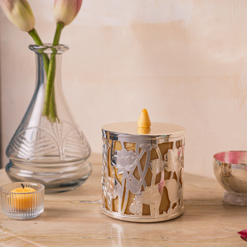 This decorative jar features intricate design work and is fully silver plated. 