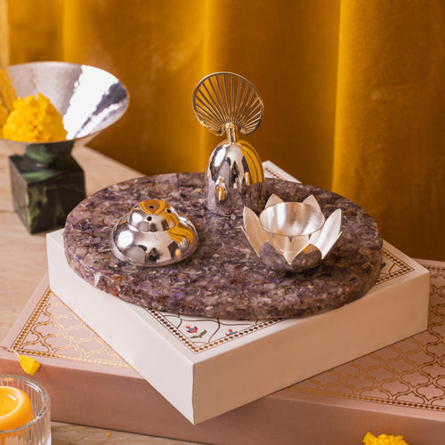 silver plated amethyst pooja thali with a silver plated bell agarbatti stand and diya 